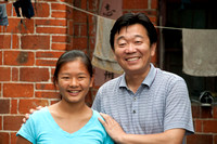 Malia and Mr. Lu in front of First Orphanage